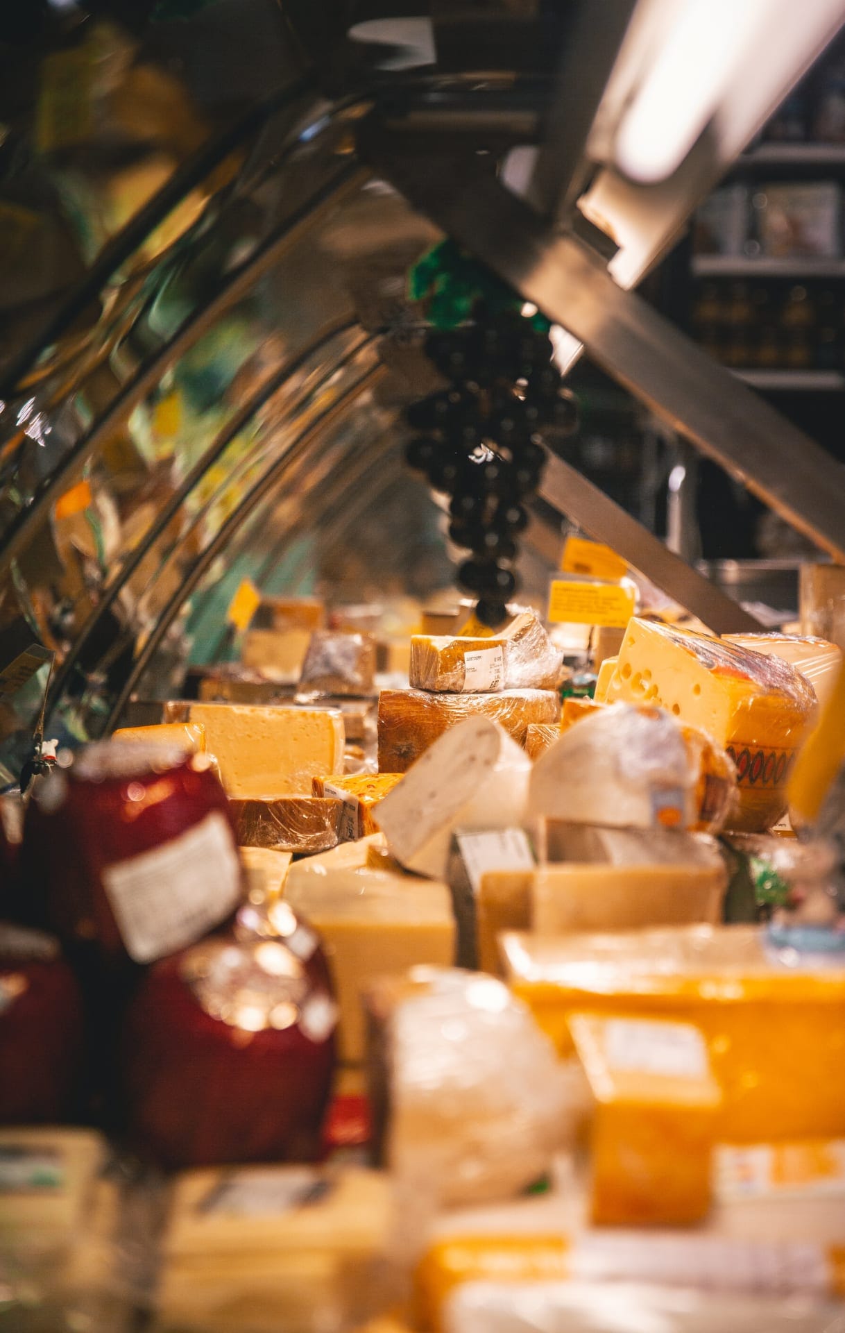 Shop counter with wide variety of cheese displayed