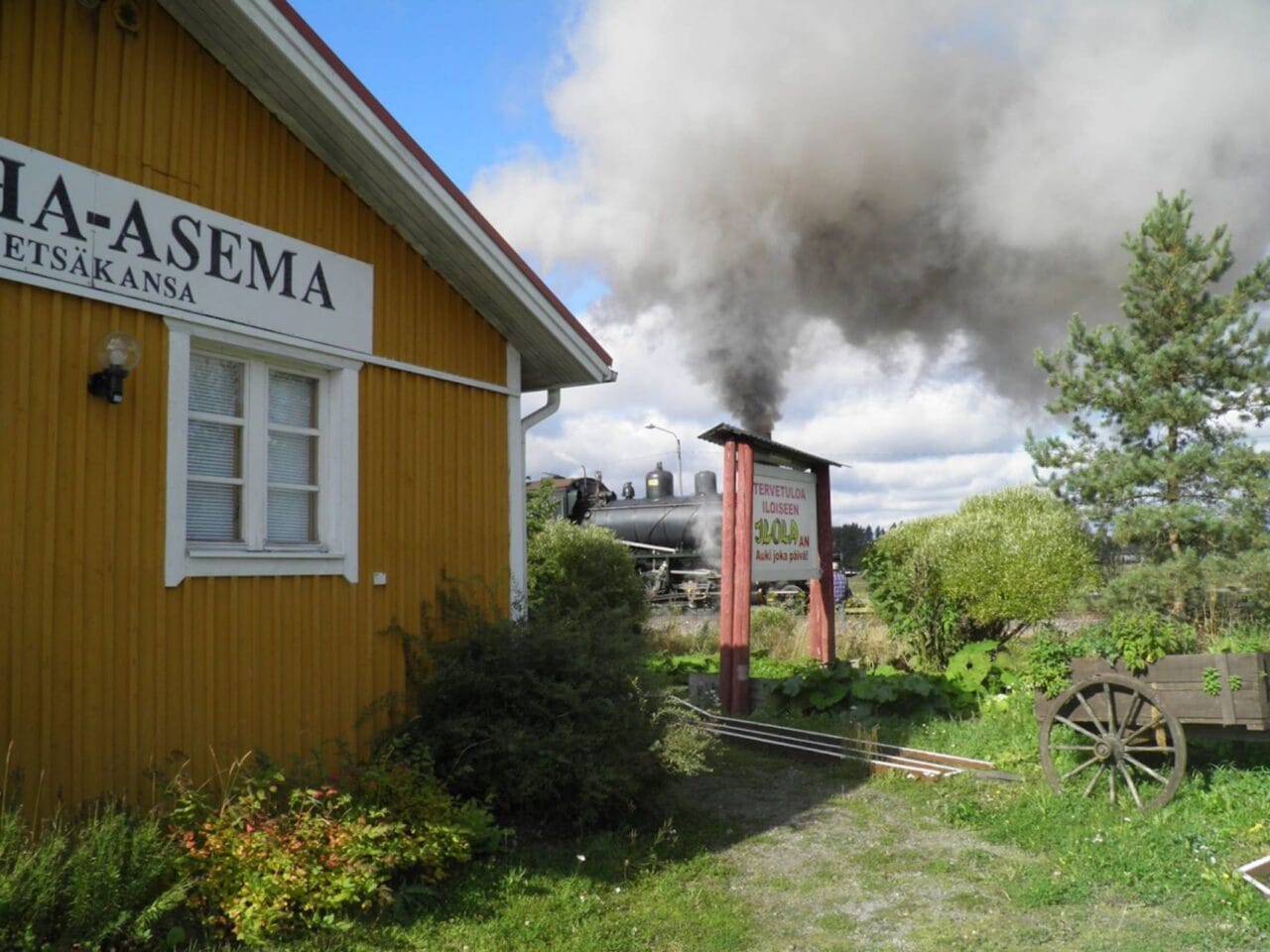 Ilola building with a steam locomotive in the background.