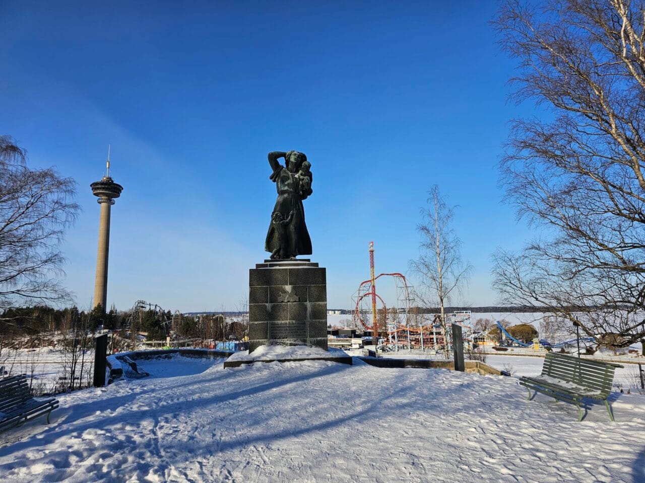 Statue on Näsinkallio hill with Särkänniemi on background