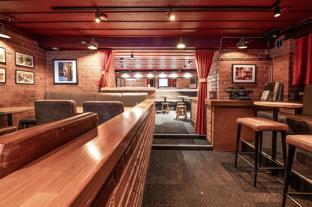 Brick wall, red velvet carpets, restaurant environment