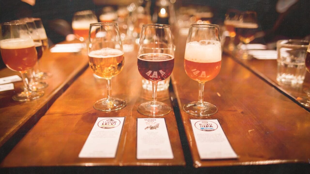 Three craft beers on a table.