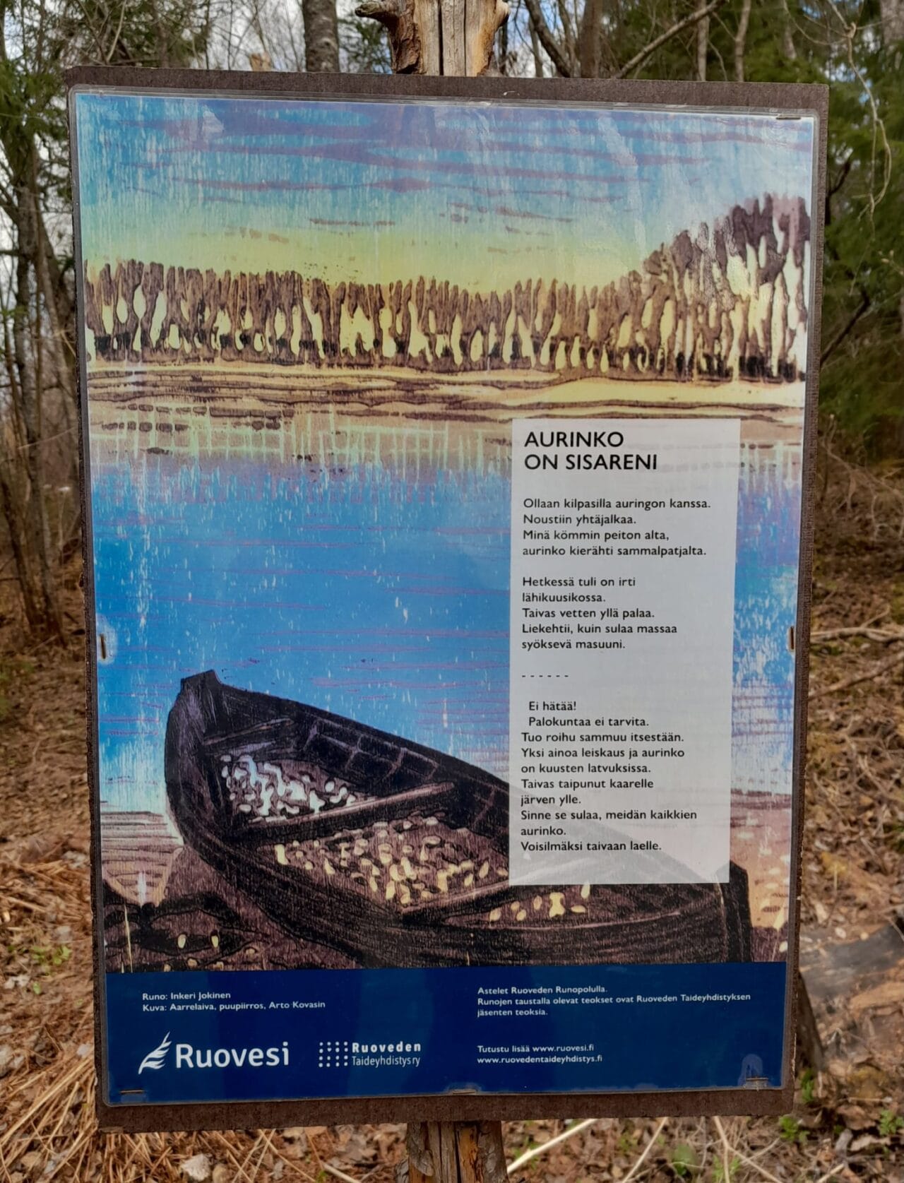 Small art boards with a picture and a poem cheer up the walk.