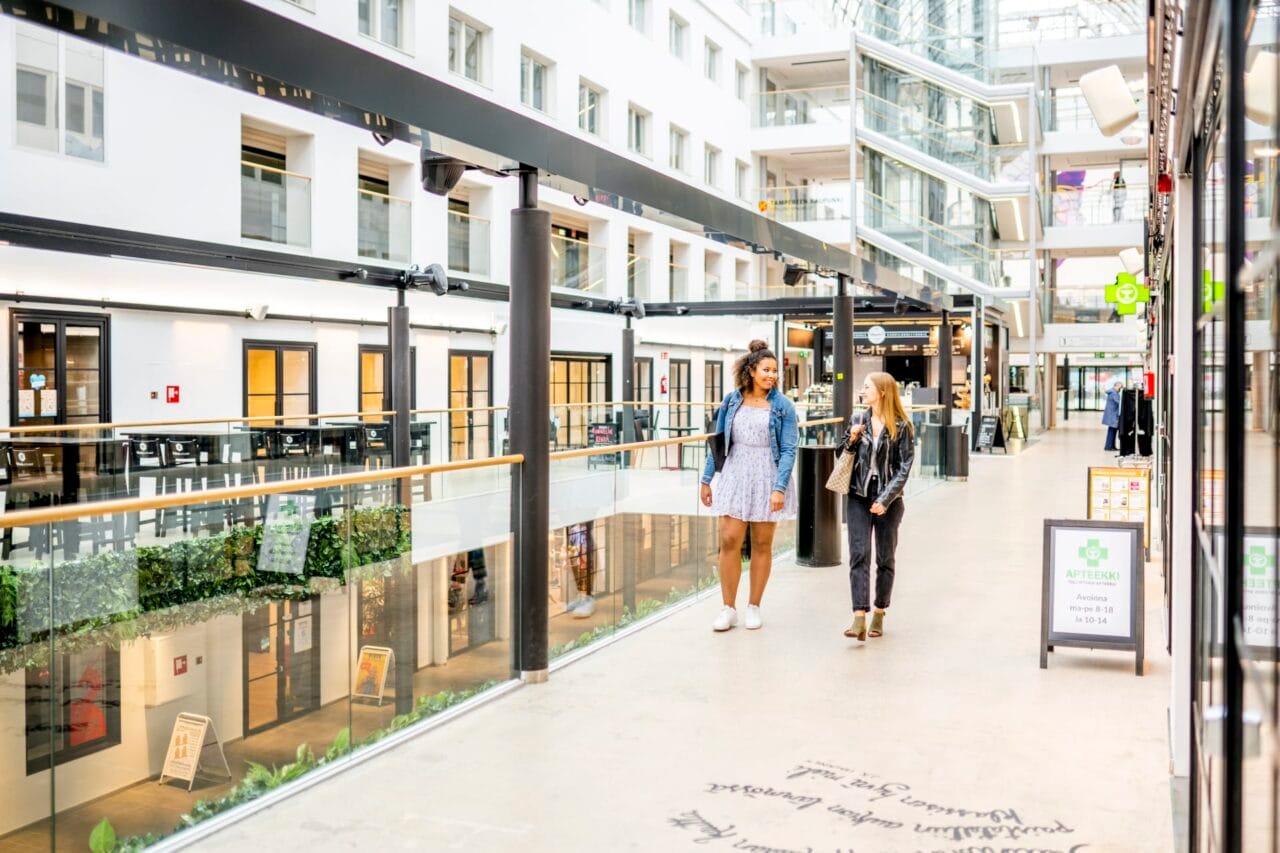 Two people walking in Tullintori shopping center.