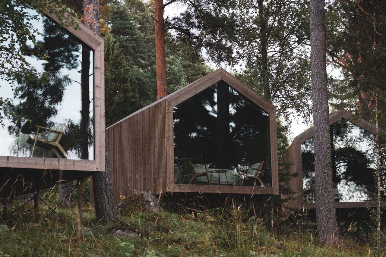 Lempee Stay cabins with glass gables in the shoreline forest